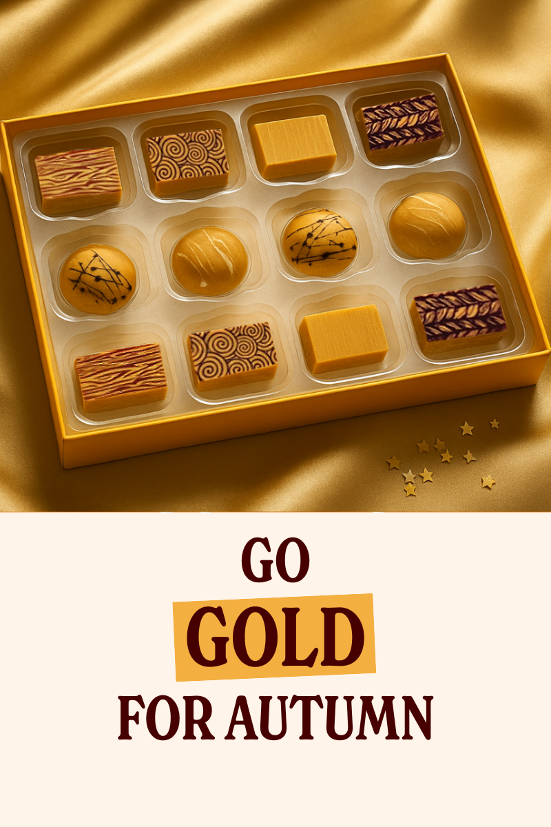 Assorted luxury chocolates in a box with a gold background and text 'GO GOLD FOR AUTUMN'.