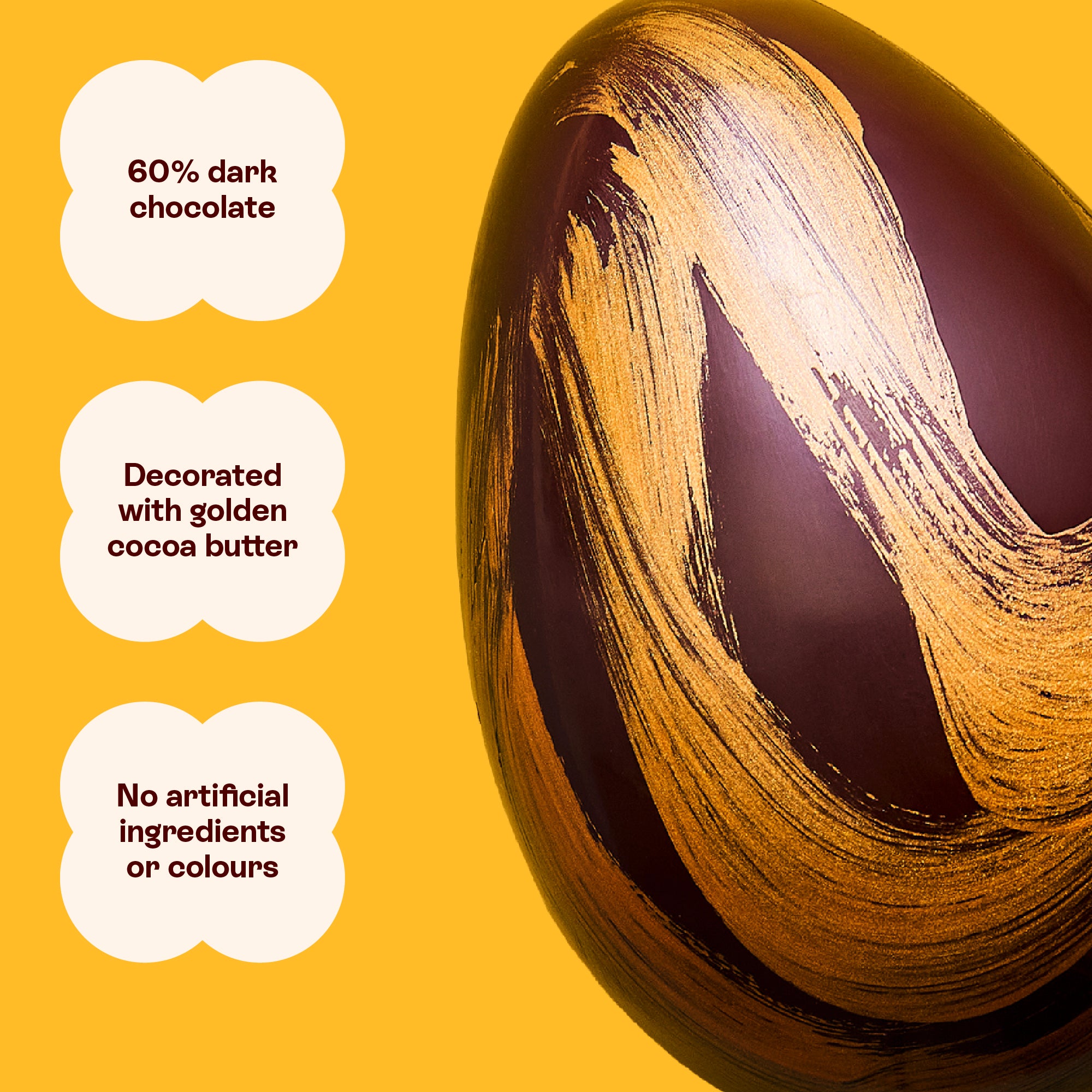 A dark chocolate luxury Easter egg decorated with golden cocoa butter and nothing artificial