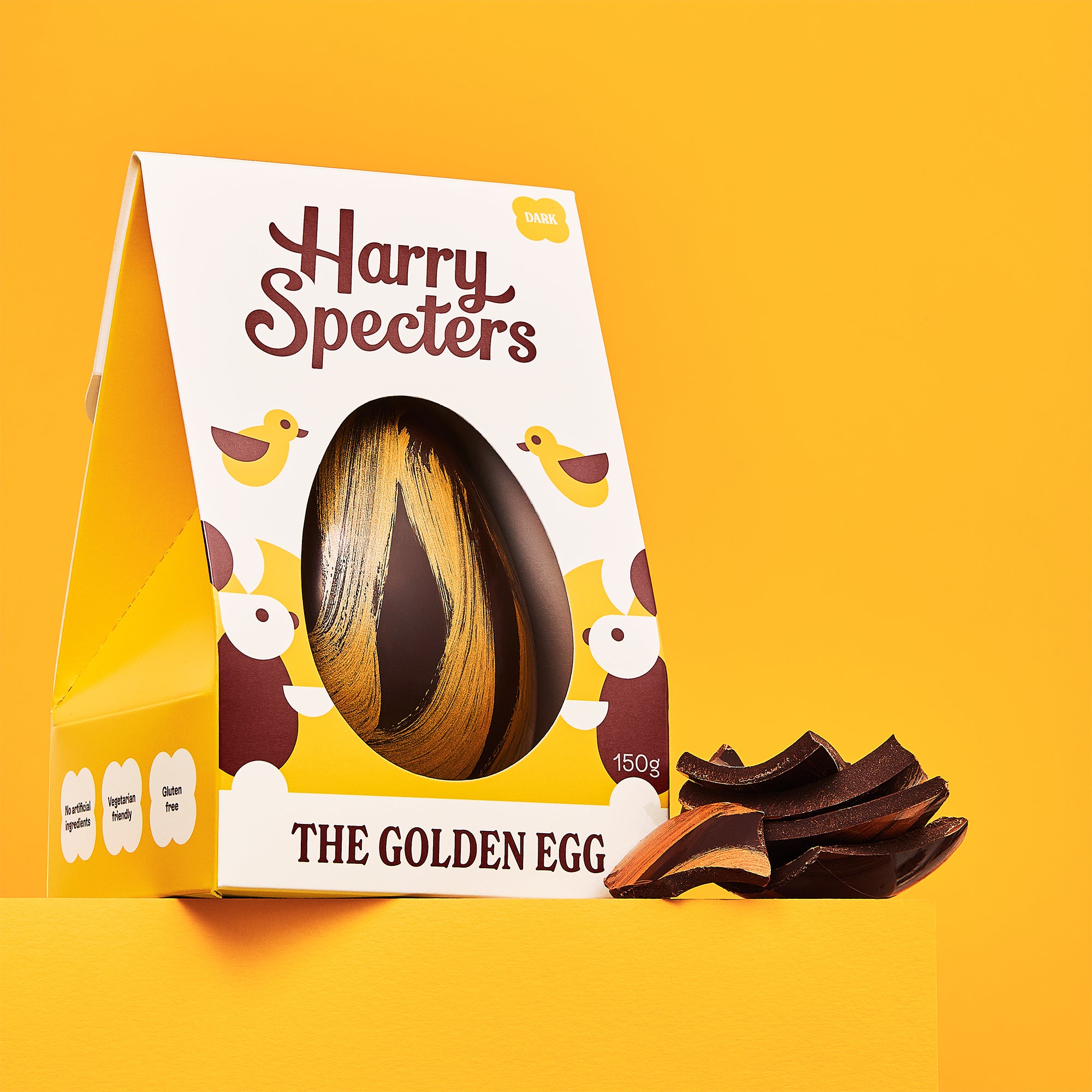 The Golden Egg is a dark chocolate luxury Easter egg shown on an orange background