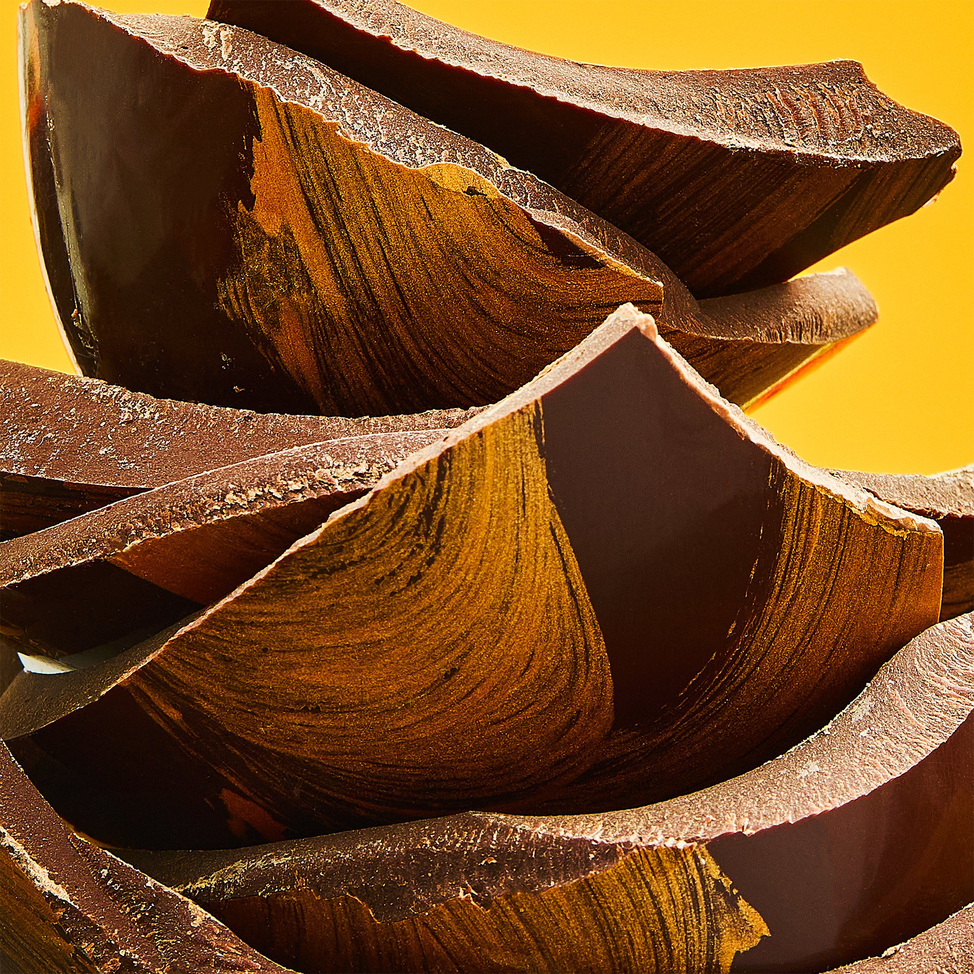 A stack of dark chocolate luxury Easter egg pieces