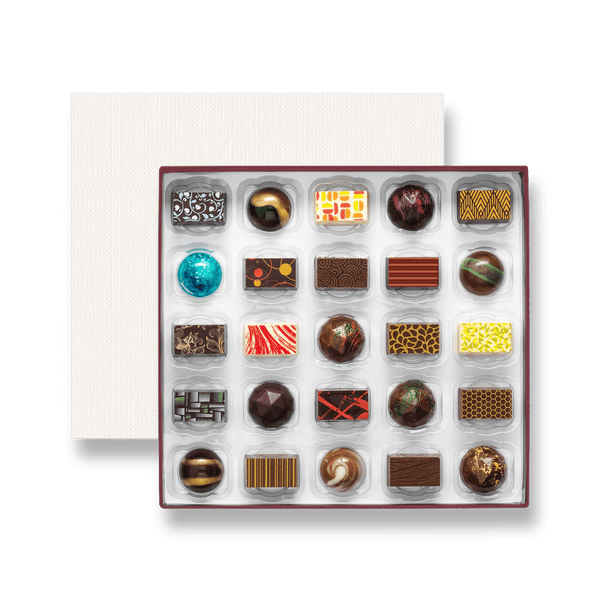 A box of 25 colourfully decorated artisan chocolates