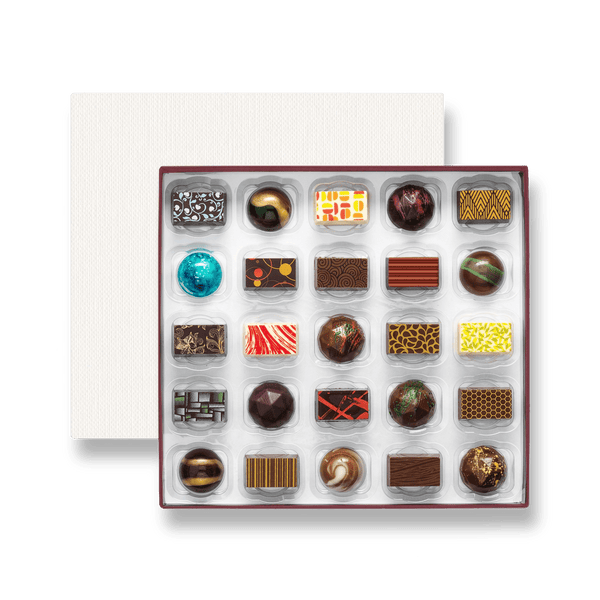 A box of 25 artisan chocolates colourfully decorated