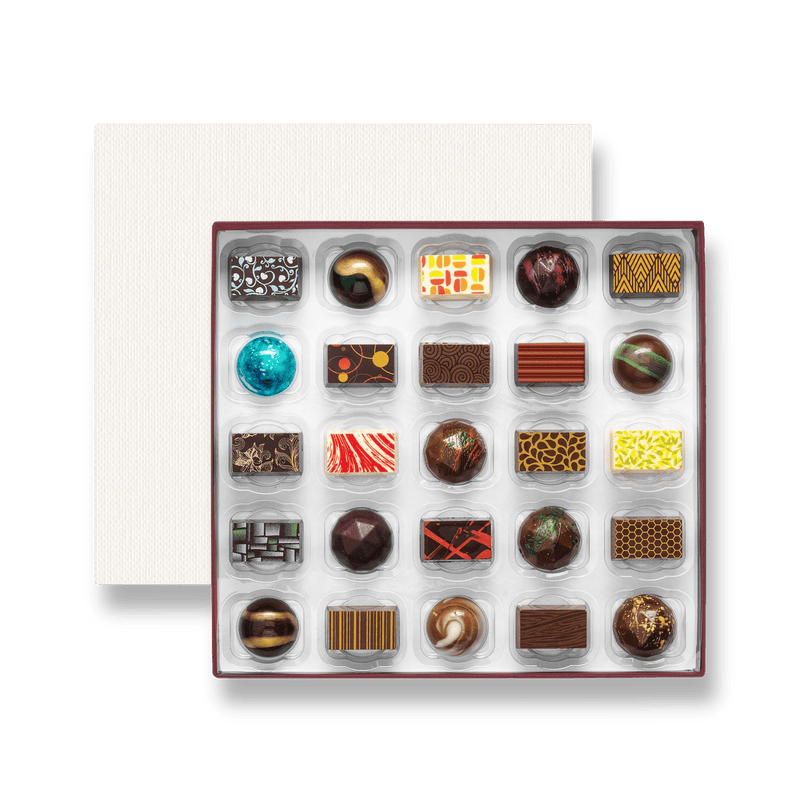 A box of 25 colourfully decorated artisan chocolates