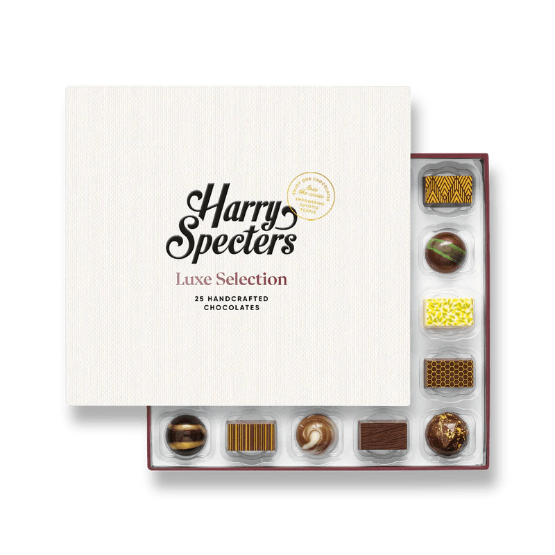 A box of 25 artisan chocolates partially covered by a box lid featuring the name Harry Specters