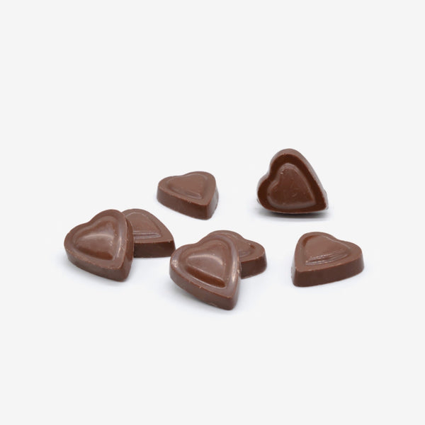 A pile of milk chocolate heart shapes for Valentine's day