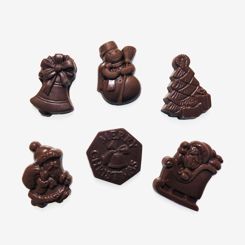 A group of milk chocolate Christmas shapes including snowmen, a Christmas tree, and Santa Claus