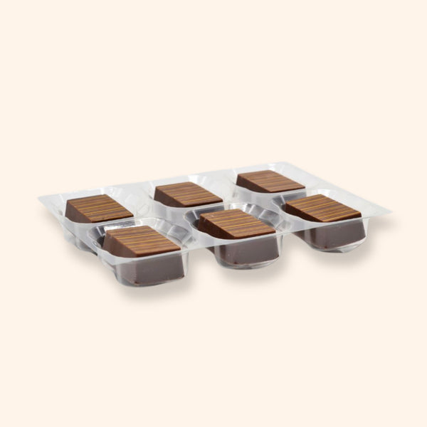 A tray of 6 peanut butter milk chocolates