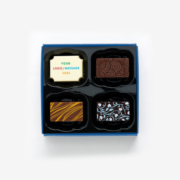 A box of 4 artisan chocolates colourfully decorated and featuring a personalised chocolate with the message your logo/message here