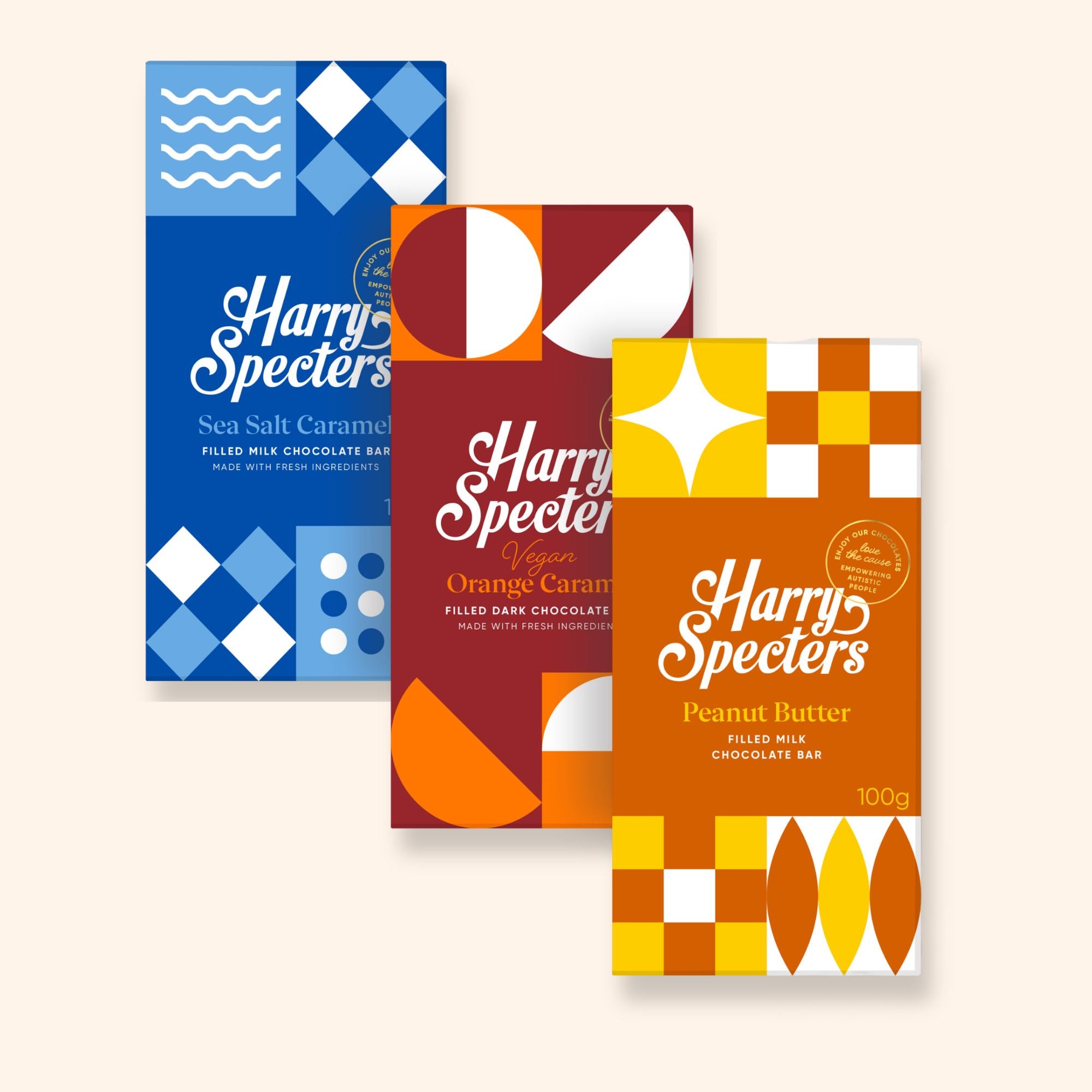 Three Harry Specters luxury chocolate bars with colourful packaging on a white background