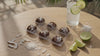 6 tropical coconut chocolates next to a glass of lemonade