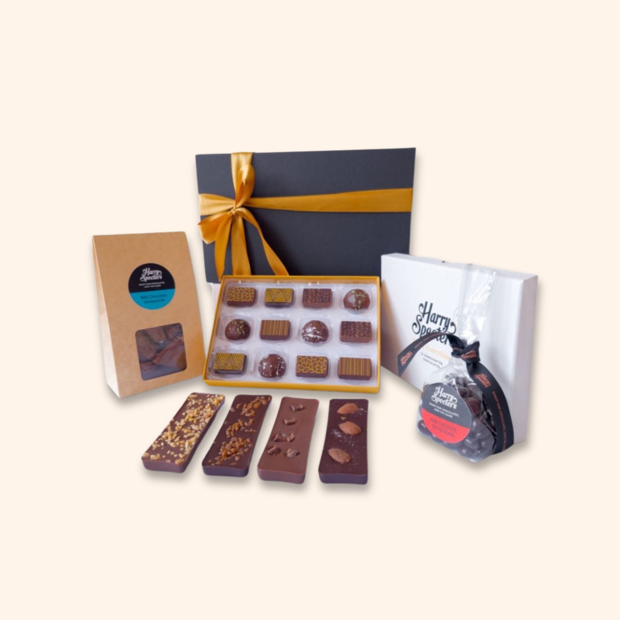A small chocolate hamper including mini chocolate bars, coffee beans, honeycomb, and a box of luxury chocolates