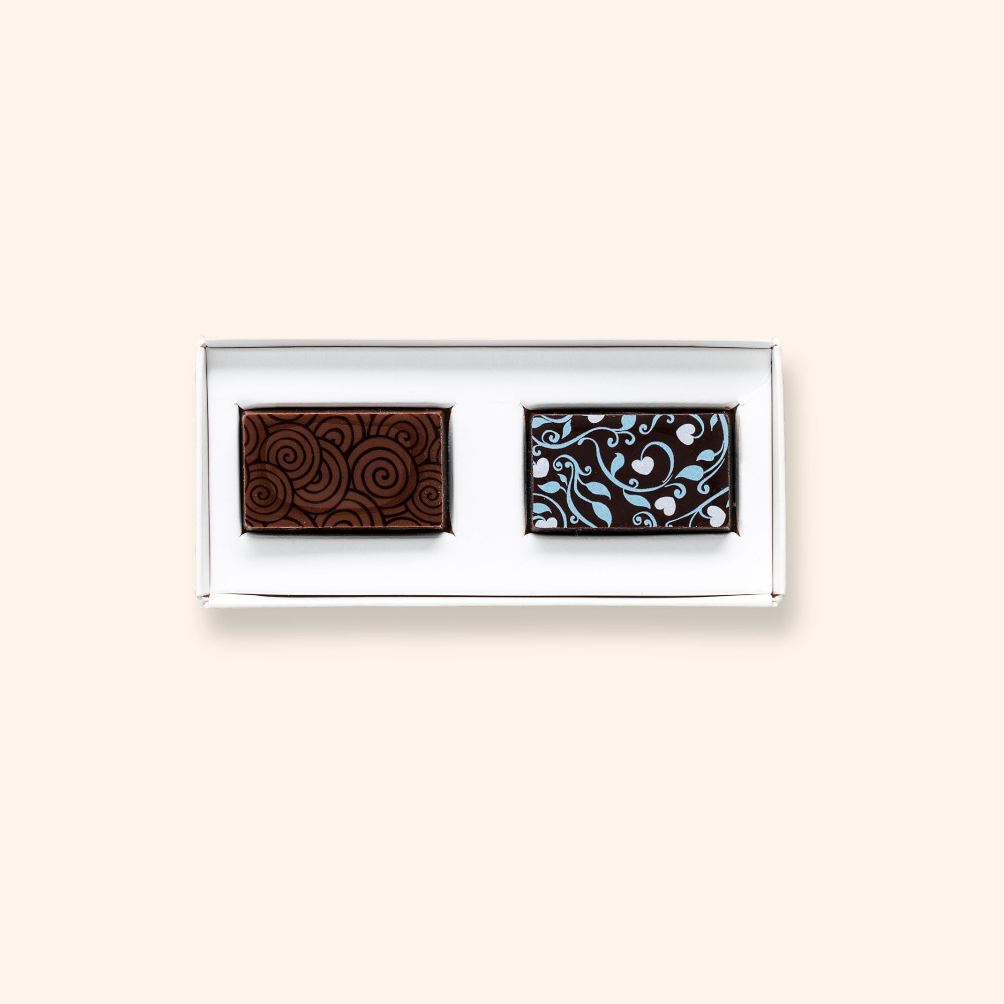 A box of 2 artisan chocolates colourfully decorated