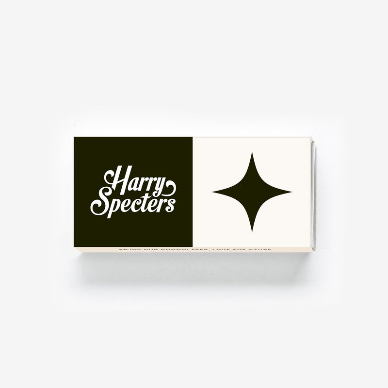 A Tasty Two chocolate box covered by a lid showing the name Harry Specters