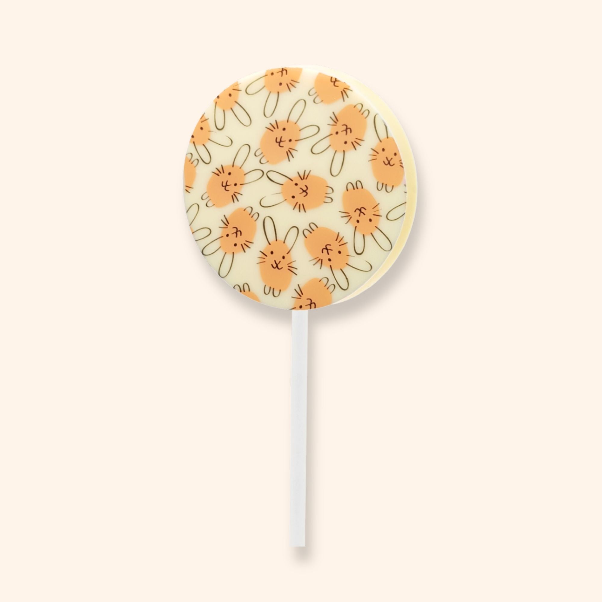 A white chocolate lollipop with an Easter bunny design