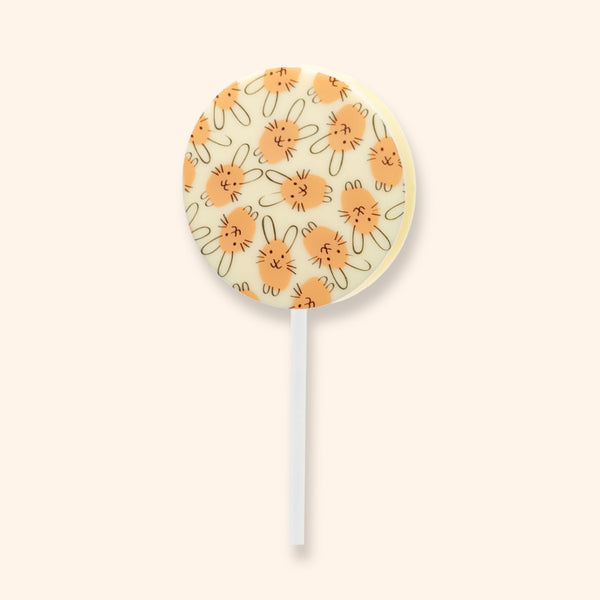 A white chocolate lollipop with an Easter bunny design