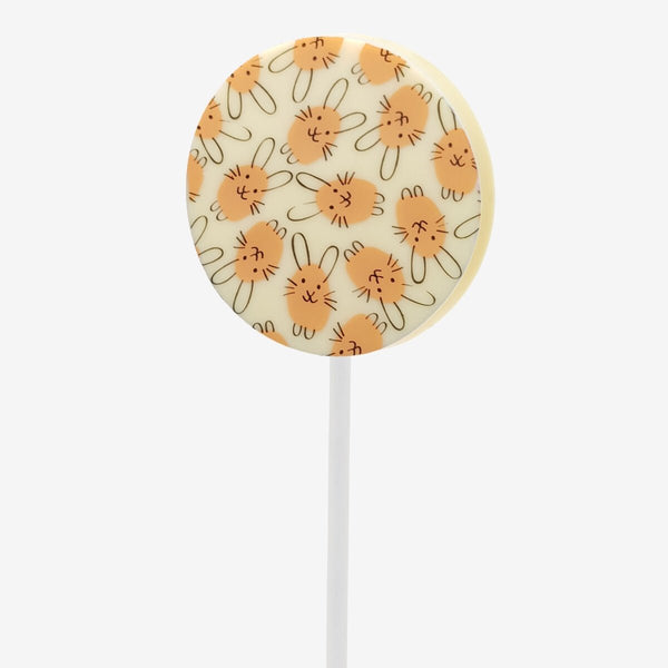 A white chocolate lollipop with an Easter bunny design