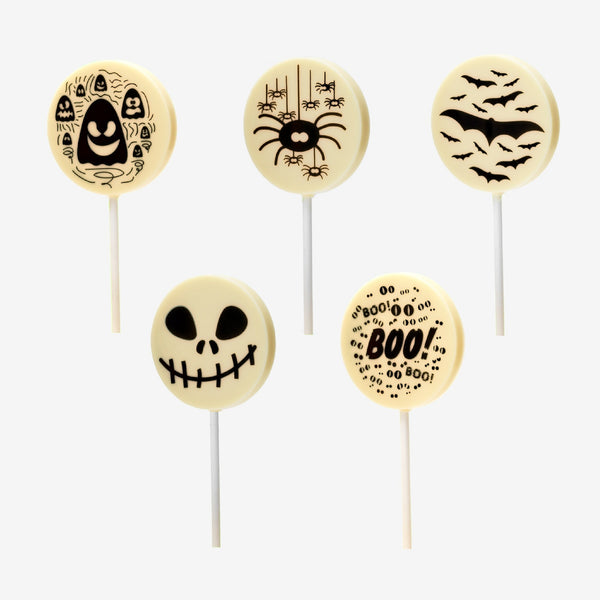 5 white chocolate lollipops featuring Halloween designs including ghosts, spiders, bats, a skull, and the word boo