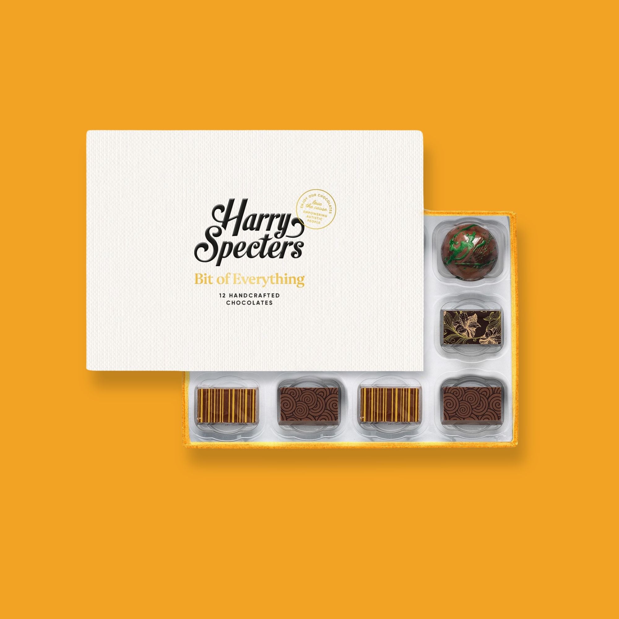A box of luxury artisan chocolates partially covered by a lid.